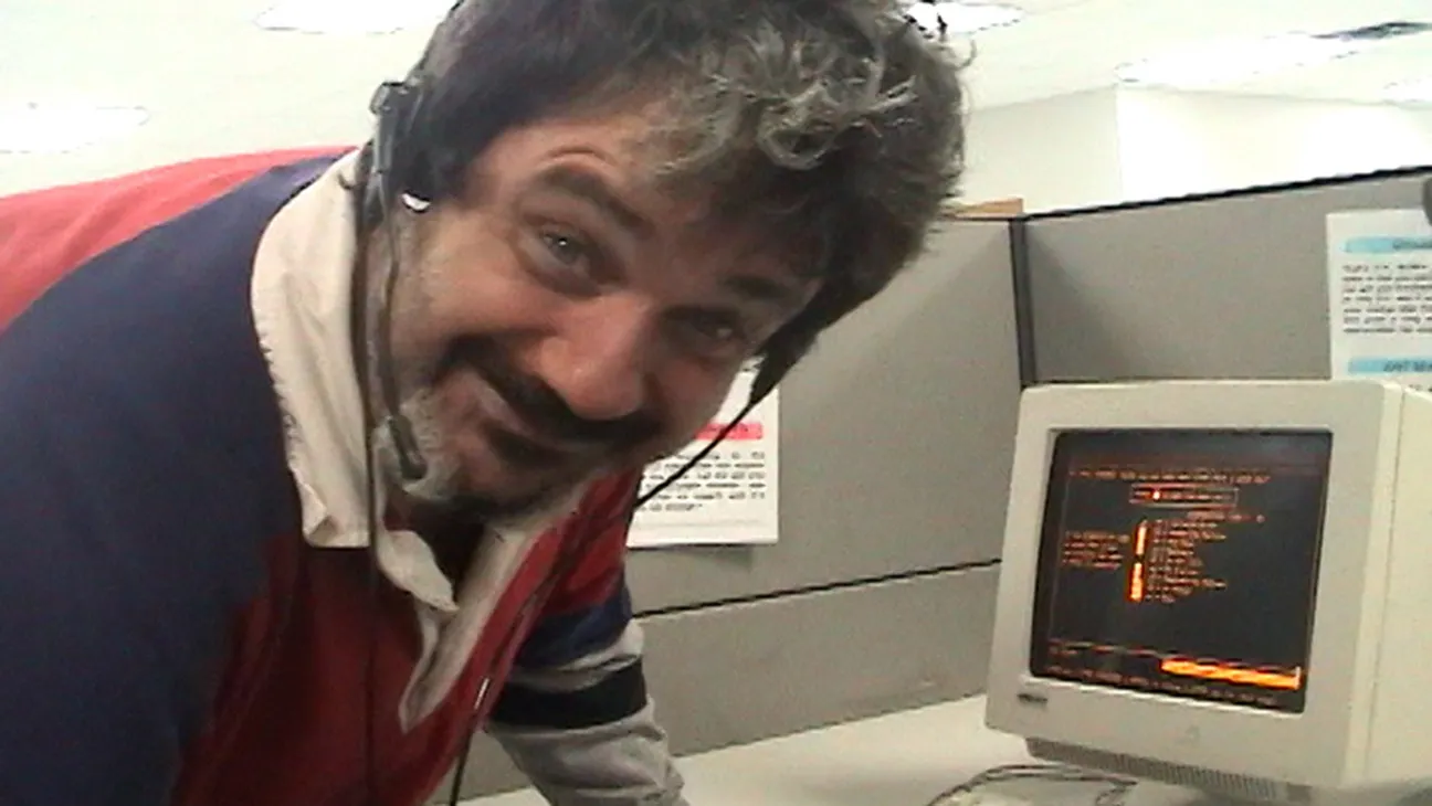 Telemarketers: Pat Pespas standing in front of his terminal
