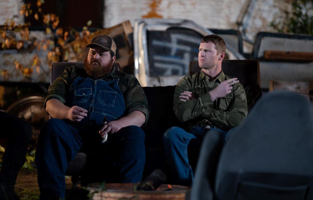 Squirrelly Dan and Wayne sitting outside smoking cigarettes