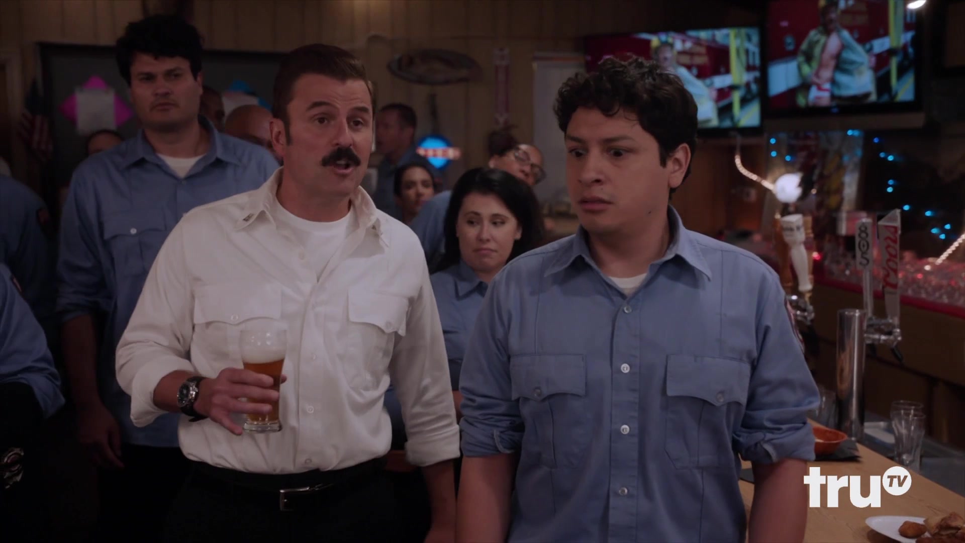 Tacoma FD: Eddie drinking (and drunk), standing next to Mickleberry in a bar