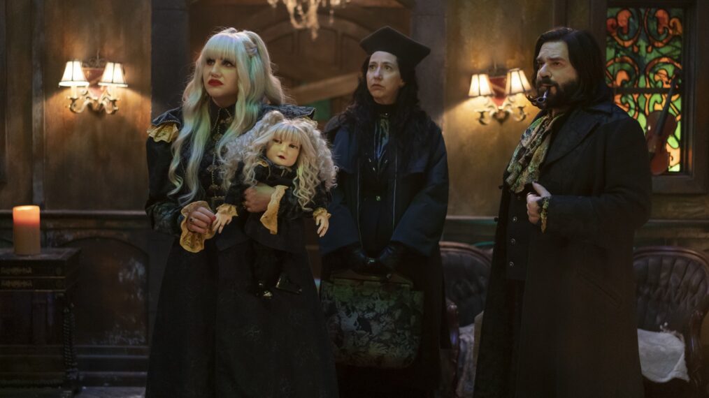 “WHAT WE DO IN THE SHADOWS” -- “Local News” --  Season 5, Episode 5 (Airs August 3) — Pictured (L-R): Kristen Schaal as The Guide, Natasia Demetriou as Nadja, Matt Berry as Laszlo.  CR: Russ Martin/ FX