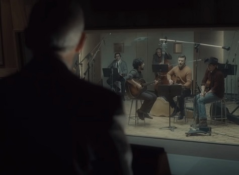 Llewyn Davis records a hit while the producer looks on.