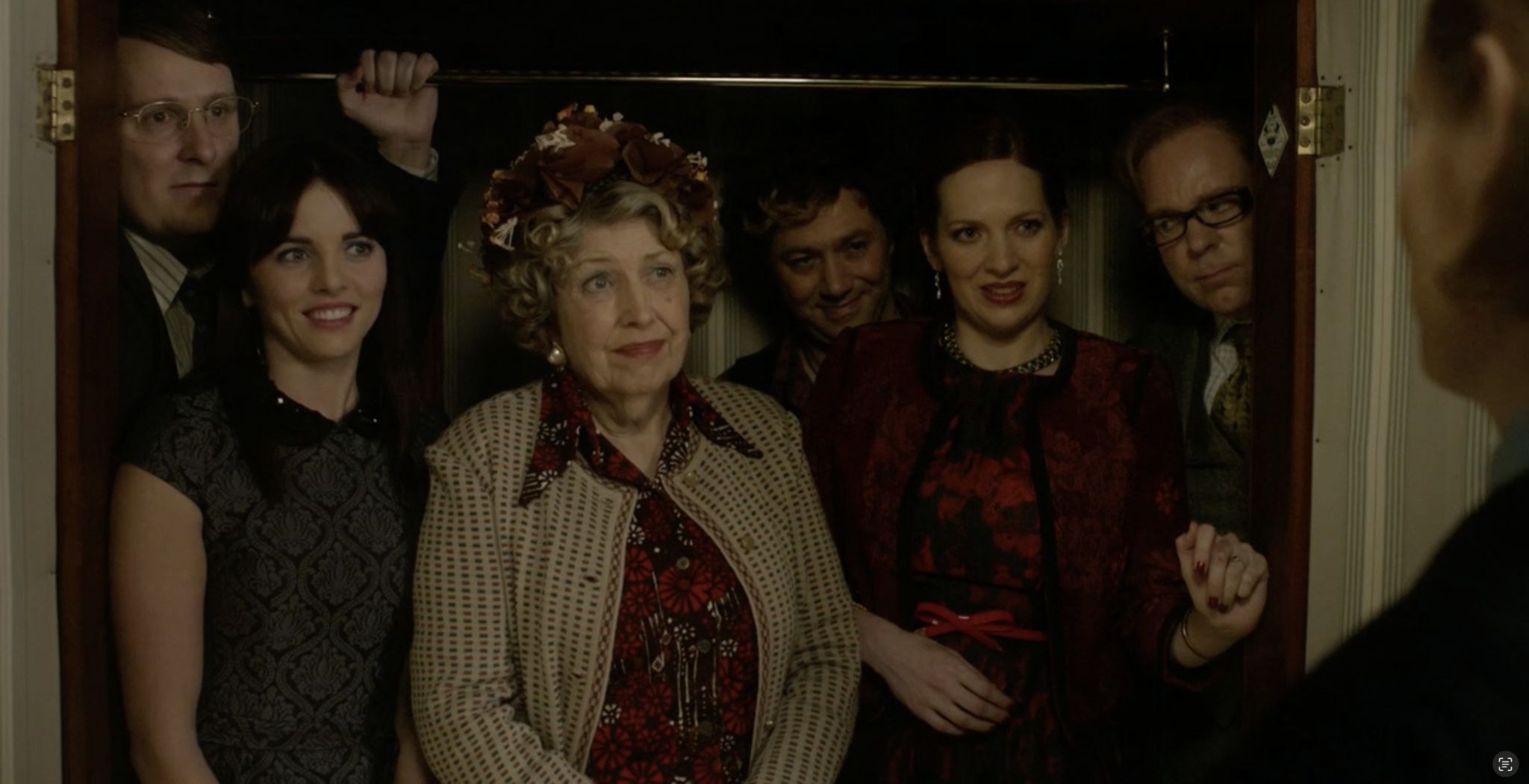 Six characters--Ian, Rachel, Geraldine, Stu, Rebecca, and Carl--are all crowded into a wardrobe.